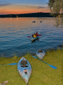 Canoes and Kayaks return to North Martindale Beach as the sun sets and music fades - photo by Michael Dwyer